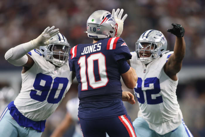Oct 1, 2023; Arlington, Texas, USA; Dallas Cowboys defensive end DeMarcus Lawrence (90) and defensive end Dorance Armstrong (92) rush New England Patriots quarterback Mac Jones (10) in the second quarter at AT&T Stadium.